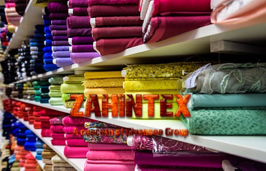 Rolls of fabric and textiles in a factory shop store